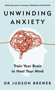 A book cover with a picture of a head and the word anxiety.