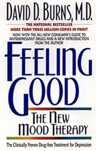 A book cover with the title of " feeling good : the new way to feel better."